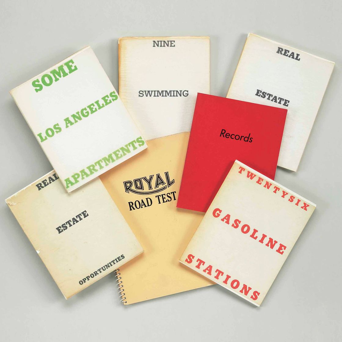 Ed Ruscha — Группа из семи книг художника "Возможности недвижимости" , 1970, Издание 4000 "Возможности недвижимости" , 1970, Издание 4000 "Некоторые квартиры в Лос-Анджелесе", 1965, Первое издание "Королевские дорожные испытания", 1967, Первое издание "Девять плавательных бассейнов", 1968, Издание 2400 "Двадцать шесть бензоколонок" , 1967, Второе издание "Рекорды" , 1971, тираж 2000 экземпляров (7)
