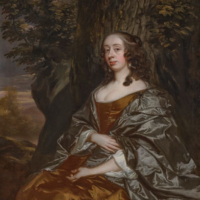 Peter Lely — Элизабет Ноэль, виконтесса Кэмпден (1640-1683), сидящая в три четверти роста, в коричневом платье, перед дубом, на фоне лесистого пейзажа