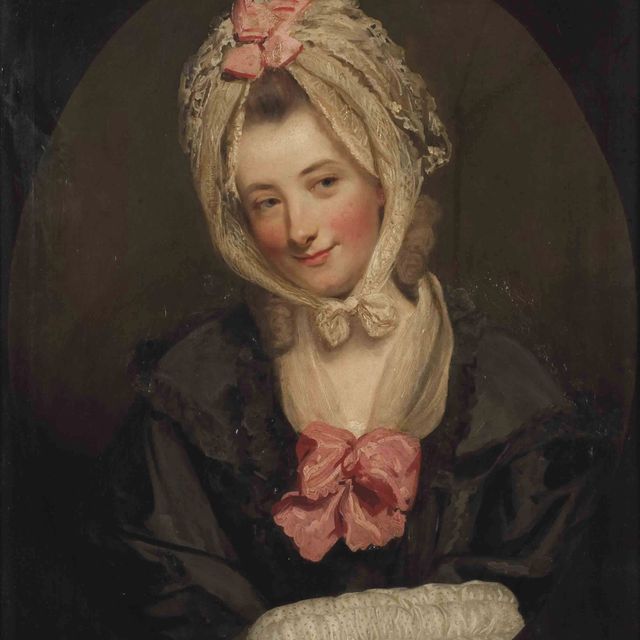Sir Joshua Reynolds — Портрет Кэтрин Шиндлерин, во весь рост, в черном пальто и белом шейно-головном платке с розовыми бантиками, с муфтой в руках, в искусственном овальном обрамлении.